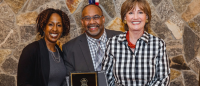 awardees pose with award
